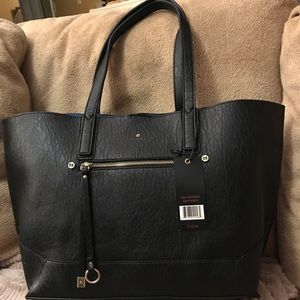 New with tags large Travanti black purse.